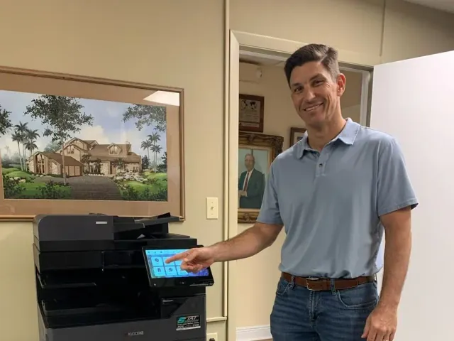 South Florida customer learning to use a newly installed office copier